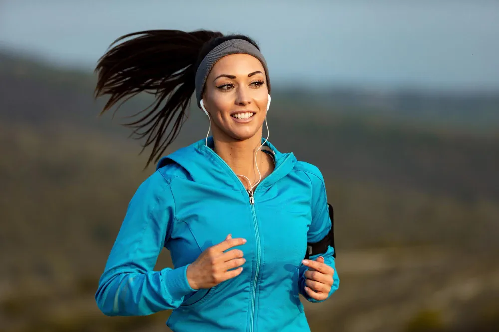 Woman jogging outdoors for emotional and physical wellbeing